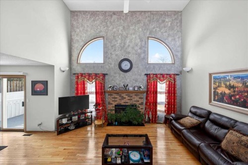 210 Shawinigan Way Sw, Calgary, AB - Indoor With Fireplace