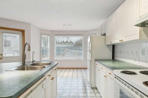 276 Hidden Valley Grove Nw, Calgary, AB - Indoor Photo Showing Kitchen With Double Sink