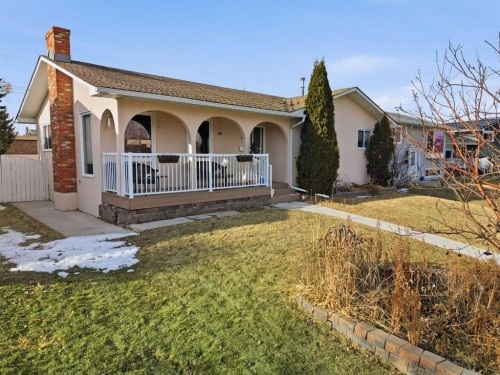 63 Huntmeadow Road Ne, Calgary, AB - Outdoor With Deck Patio Veranda