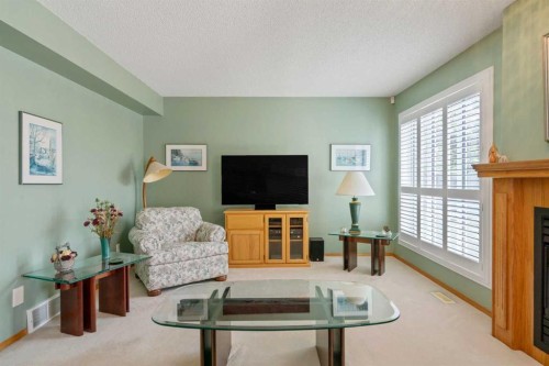 79 Scenic Gardens Nw, Calgary, AB - Indoor Photo Showing Living Room With Fireplace