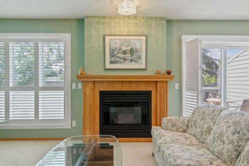 79 Scenic Gardens Nw, Calgary, AB - Indoor Photo Showing Living Room With Fireplace