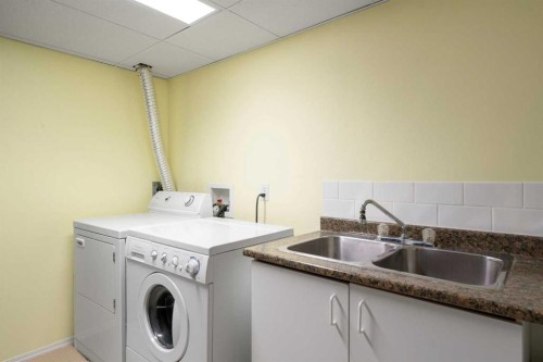 79 Scenic Gardens Nw, Calgary, AB - Indoor Photo Showing Laundry Room