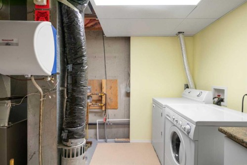 79 Scenic Gardens Nw, Calgary, AB - Indoor Photo Showing Laundry Room