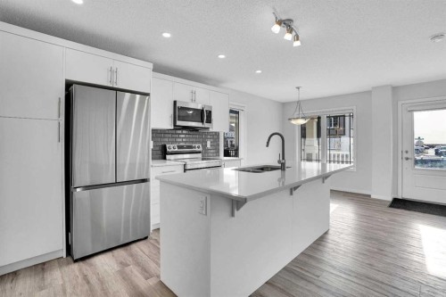 408 Windbury Link Sw, Airdrie, AB - Indoor Photo Showing Kitchen With Stainless Steel Kitchen With Upgraded Kitchen