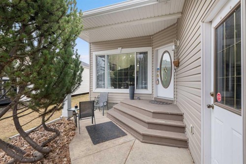 704 Woodside Drive, Airdrie, AB - Outdoor With Deck Patio Veranda With Exterior