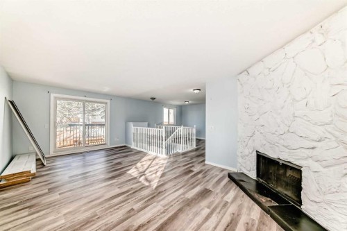 151F Pinehill Road Ne, Calgary, AB - Indoor Photo Showing Living Room With Fireplace