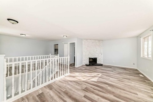 151F Pinehill Road Ne, Calgary, AB - Indoor Photo Showing Other Room With Fireplace