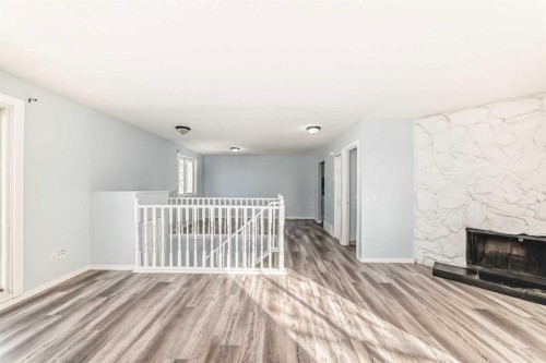 151F Pinehill Road Ne, Calgary, AB - Indoor With Fireplace