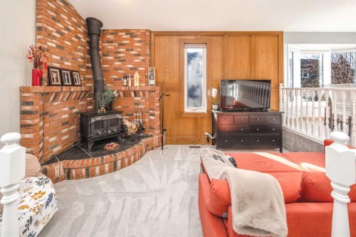 111 Edforth Place Nw, Calgary, AB - Indoor Photo Showing Living Room With Fireplace