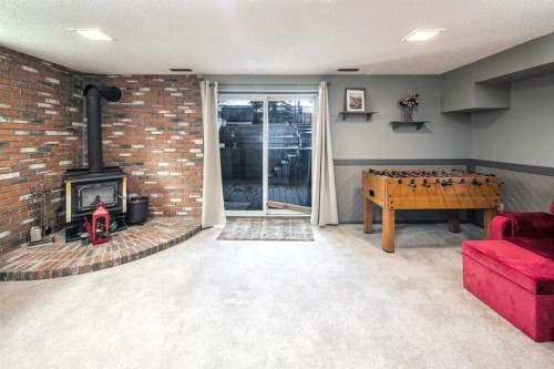 111 Edforth Place Nw, Calgary, AB - Indoor Photo Showing Other Room With Fireplace