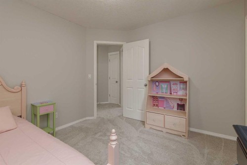 86 Cougarstone Court Sw, Calgary, AB - Indoor Photo Showing Bedroom