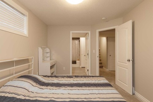 86 Cougarstone Court Sw, Calgary, AB - Indoor Photo Showing Bedroom