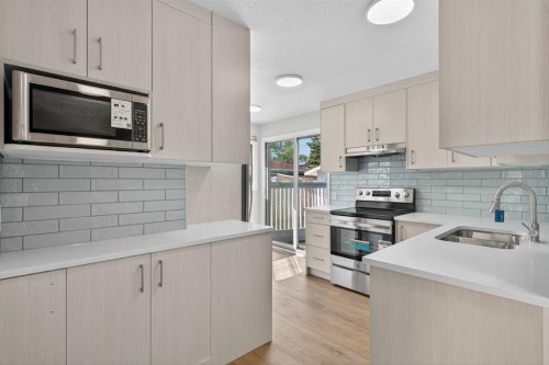 5923 Centre Street Nw, Calgary, AB - Indoor Photo Showing Kitchen With Double Sink With Upgraded Kitchen