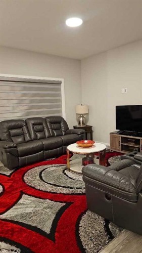 210 Lucas Close Nw, Calgary, AB - Indoor Photo Showing Living Room