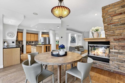 12069 Valley Ridge Drive Nw, Calgary, AB - Indoor Photo Showing Dining Room With Fireplace