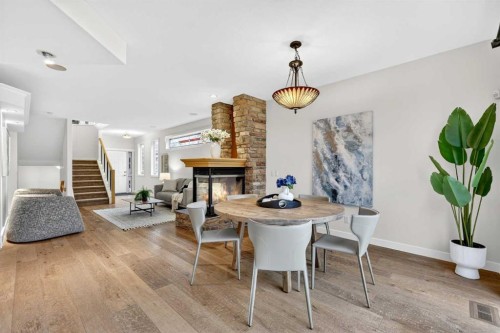 12069 Valley Ridge Drive Nw, Calgary, AB - Indoor Photo Showing Dining Room With Fireplace