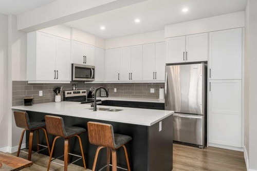915 Crestridge Common Sw, Calgary, AB - Indoor Photo Showing Kitchen With Double Sink With Upgraded Kitchen