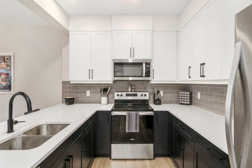 915 Crestridge Common Sw, Calgary, AB - Indoor Photo Showing Kitchen With Double Sink With Upgraded Kitchen