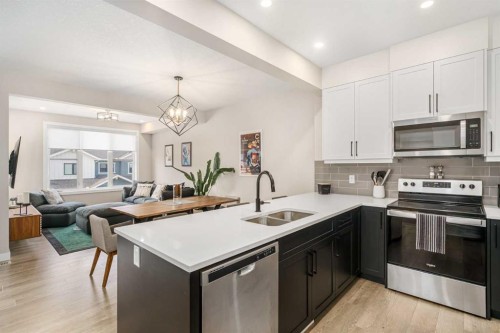 915 Crestridge Common Sw, Calgary, AB - Indoor Photo Showing Kitchen With Double Sink