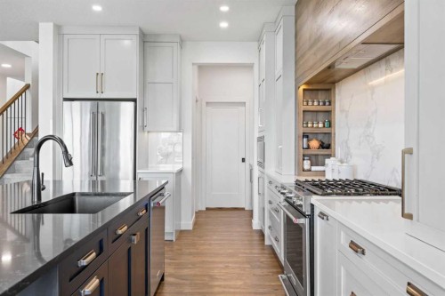 656 Bayview Way Sw, Airdrie, AB - Indoor Photo Showing Kitchen With Upgraded Kitchen