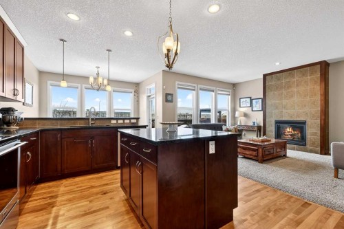 401 Mahogany Court Se, Calgary, AB - Indoor Photo Showing Kitchen With Fireplace With Double Sink