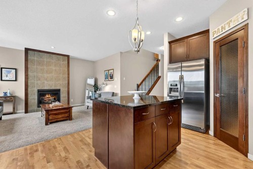 401 Mahogany Court Se, Calgary, AB - Indoor Photo Showing Kitchen With Fireplace