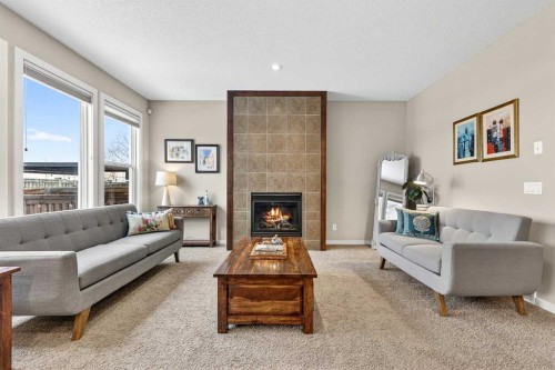 401 Mahogany Court Se, Calgary, AB - Indoor Photo Showing Living Room With Fireplace