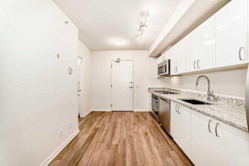 310-450 8 Avenue Se, Calgary, AB - Indoor Photo Showing Kitchen With Upgraded Kitchen