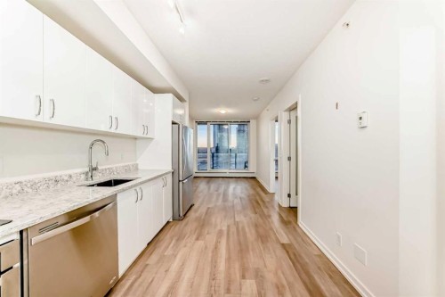 310-450 8 Avenue Se, Calgary, AB - Indoor Photo Showing Kitchen With Upgraded Kitchen