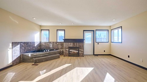 131 Arbour Wood Close Nw, Calgary, AB - Indoor Photo Showing Living Room With Fireplace