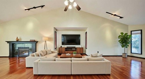 131 Arbour Wood Close Nw, Calgary, AB - Indoor Photo Showing Living Room With Fireplace