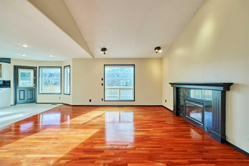 131 Arbour Wood Close Nw, Calgary, AB - Indoor Photo Showing Other Room With Fireplace