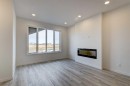 37 Setonvista Gate Se, Calgary, AB  - Indoor Photo Showing Living Room With Fireplace 