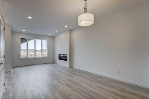 37 Setonvista Gate Se, Calgary, AB - Indoor Photo Showing Other Room With Fireplace