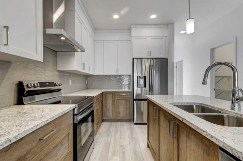 37 Setonvista Gate Se, Calgary, AB - Indoor Photo Showing Kitchen With Stainless Steel Kitchen With Double Sink With Upgraded Kitchen