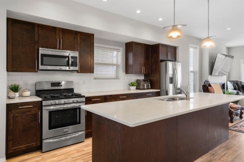 2001-280 Williamstown Close Nw, Airdrie, AB - Indoor Photo Showing Kitchen With Stainless Steel Kitchen With Double Sink With Upgraded Kitchen