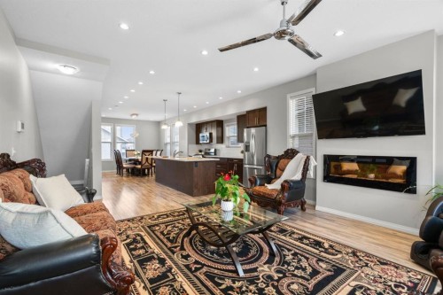 2001-280 Williamstown Close Nw, Airdrie, AB - Indoor Photo Showing Living Room With Fireplace