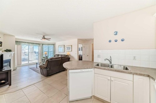 111-6900 Hunterview Drive Nw, Calgary, AB - Indoor Photo Showing Other Room With Fireplace