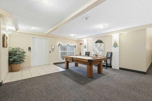 111-6900 Hunterview Drive Nw, Calgary, AB - Indoor Photo Showing Other Room