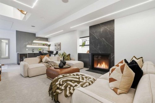 134 Lissington Drive Sw, Calgary, AB - Indoor Photo Showing Living Room With Fireplace
