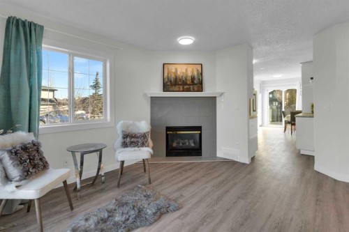103 Canoe Square Sw, Airdrie, AB - Indoor Photo Showing Living Room With Fireplace