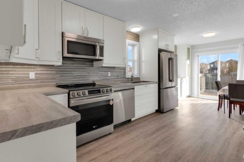 103 Canoe Square Sw, Airdrie, AB - Indoor Photo Showing Kitchen With Upgraded Kitchen