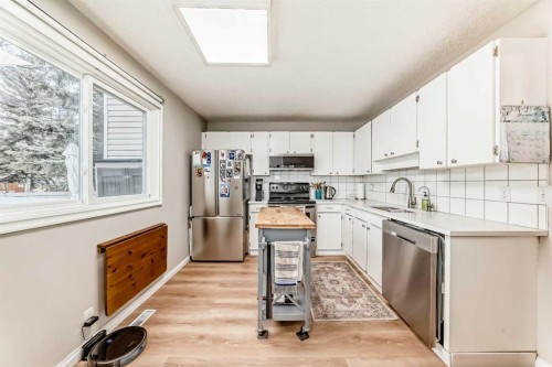21 Woodfern Road Sw, Calgary, AB - Indoor Photo Showing Kitchen With Stainless Steel Kitchen