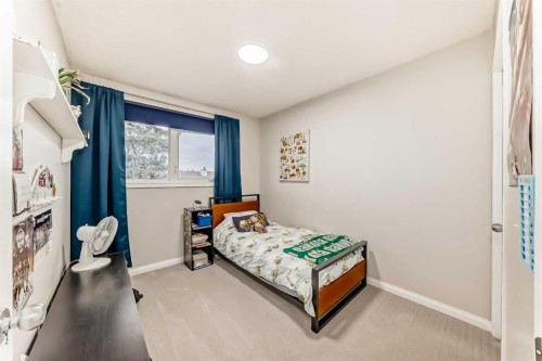 21 Woodfern Road Sw, Calgary, AB - Indoor Photo Showing Bedroom