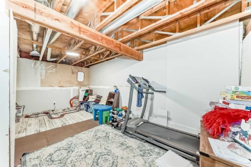 21 Woodfern Road Sw, Calgary, AB - Indoor Photo Showing Gym Room