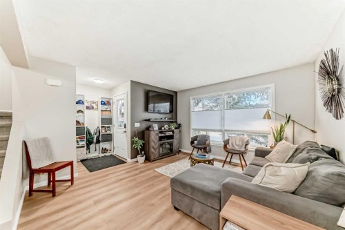 21 Woodfern Road Sw, Calgary, AB - Indoor Photo Showing Living Room