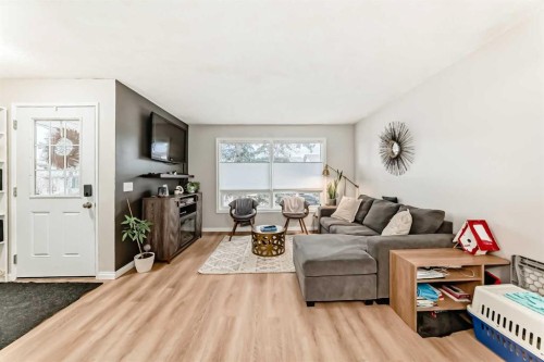 21 Woodfern Road Sw, Calgary, AB - Indoor Photo Showing Living Room