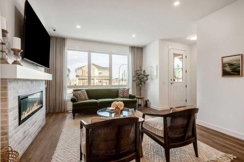 199 Annette Landing, Calgary, AB - Indoor Photo Showing Living Room With Fireplace