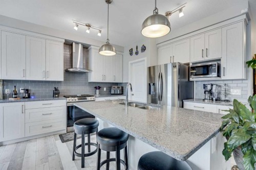 137 Amery Crest, Crossfield, AB - Indoor Photo Showing Kitchen With Double Sink With Upgraded Kitchen