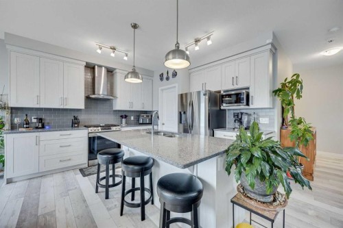 137 Amery Crest, Crossfield, AB - Indoor Photo Showing Kitchen With Stainless Steel Kitchen With Double Sink With Upgraded Kitchen
